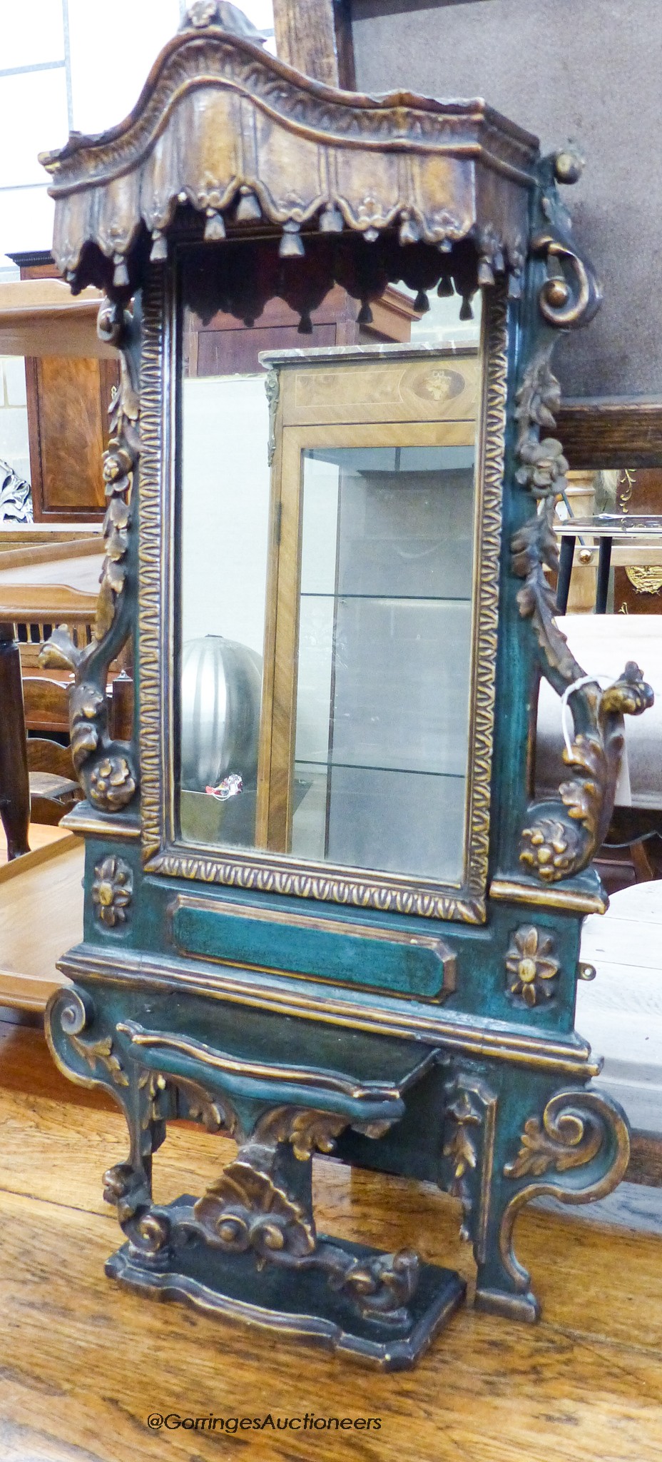 An Iberian green-painted and parcel-gilt rectangular wall mirror